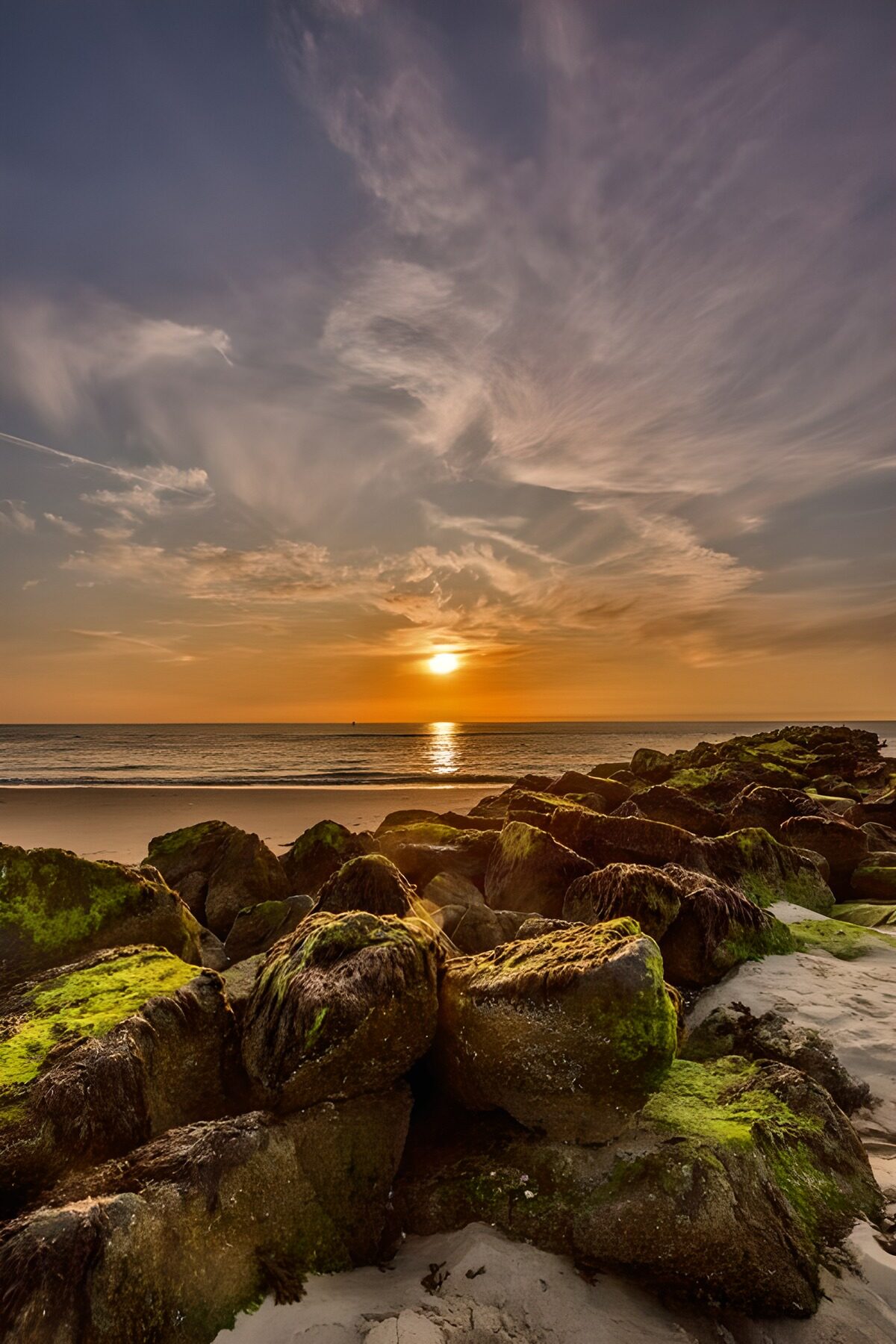 Zonsondergang bij de kust